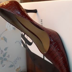 Leather look brown pointed toe heels, slightly used.